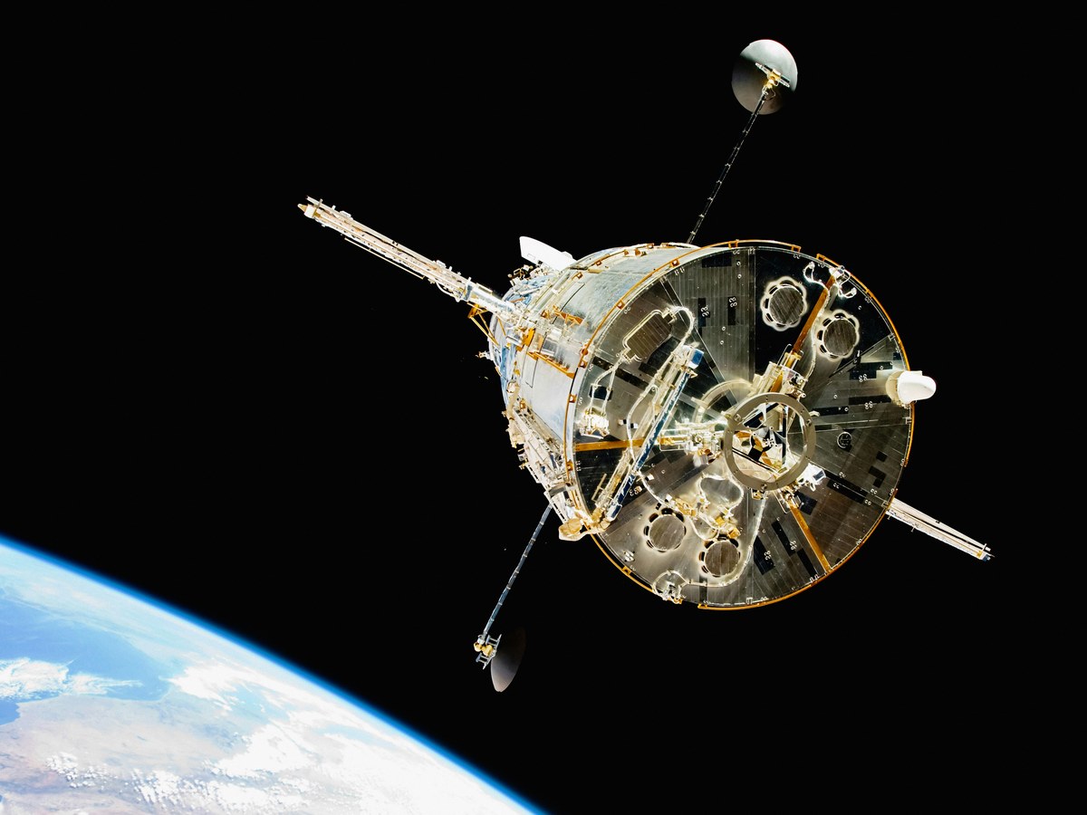 The Hubble Space Telescope in orbit over the limb of Earth