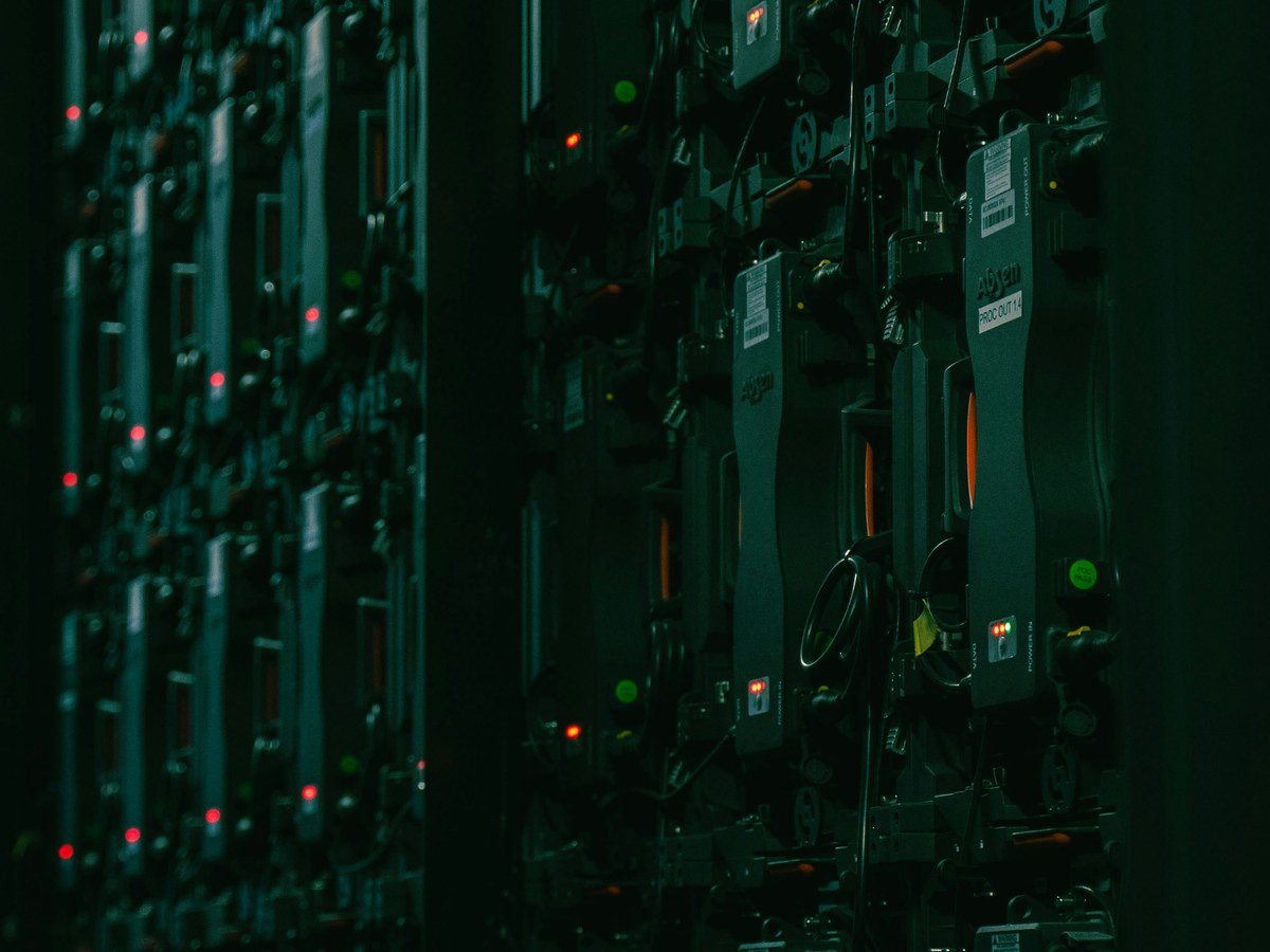 Server racks in a dark data hall